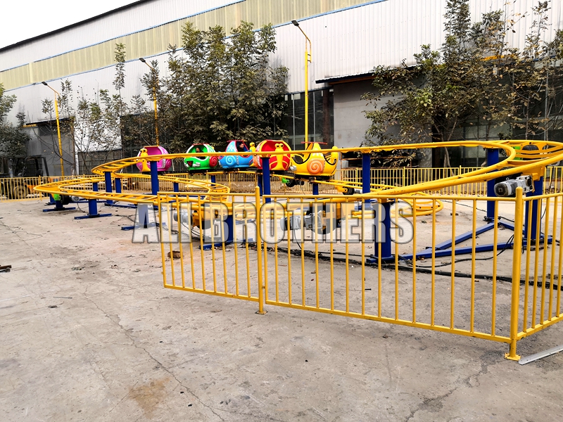 Amusement park snail design mini sliding roller coaster for sale